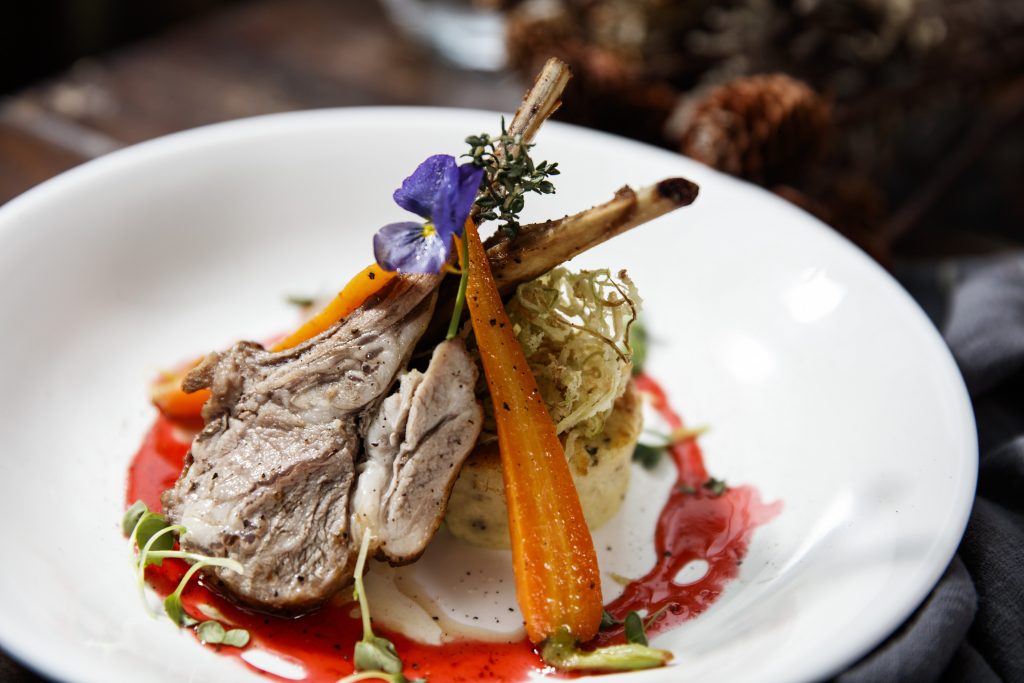 ROASTED RACK OF LAMB, POTATO FLAN WITH GLAZED BABY CARROTS AND MONTEPULCIANO WINE SAUCE