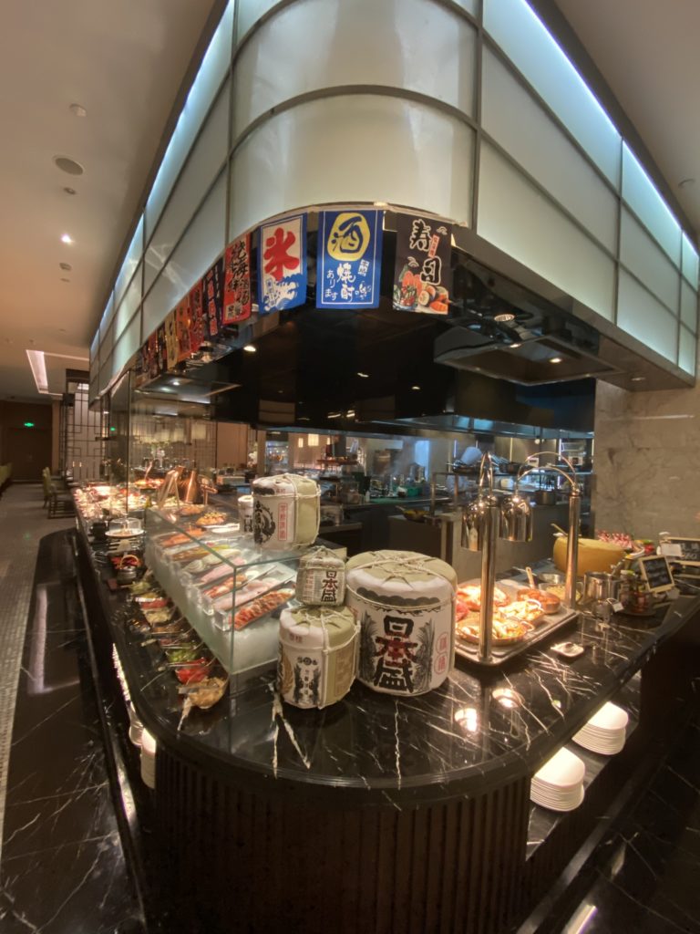 The dinner buffet has a selection of sushi and sashimi. Create your own sauces from an array of ingredients.