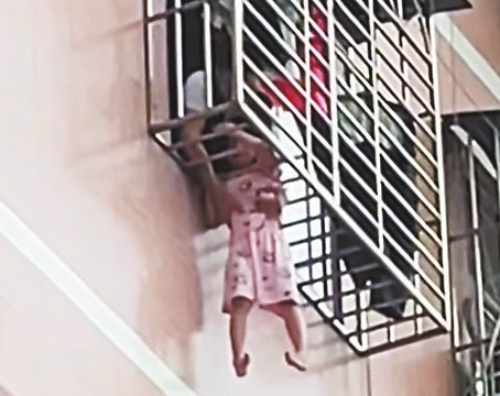 Residents Save Local Girl Dangling from Windowsill